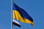 На площі Героїв Мостиської громади було піднято біло-чорний стяг